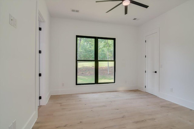 unfurnished room with ceiling fan and light hardwood / wood-style floors