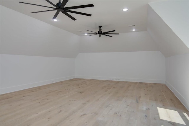 bonus room with ceiling fan, light hardwood / wood-style flooring, and vaulted ceiling