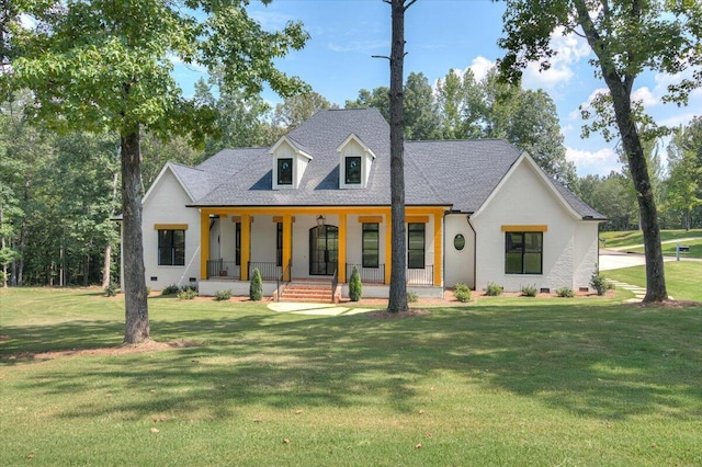 view of front facade with covered porch and a front yard