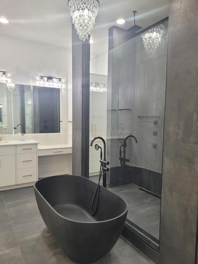 bathroom featuring vanity and a notable chandelier