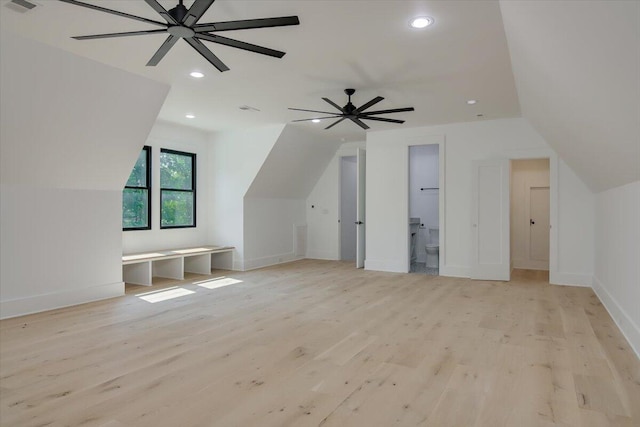 bonus room featuring ceiling fan, light hardwood / wood-style floors, and lofted ceiling