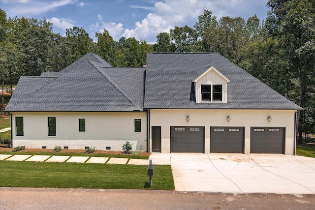 view of front facade featuring a front lawn and a garage