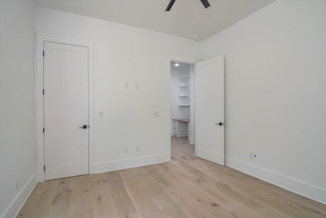 unfurnished bedroom featuring ceiling fan and light hardwood / wood-style flooring