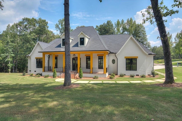 view of front of house with covered porch and a front lawn