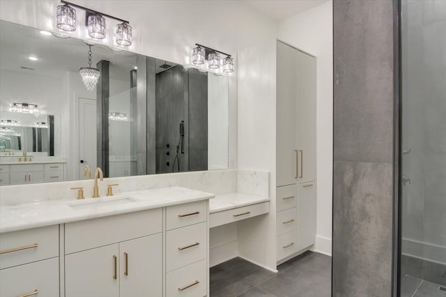 bathroom with tile patterned flooring, vanity, and a shower with shower door