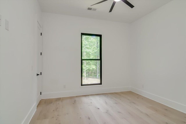 empty room featuring ceiling fan and light wood-type flooring