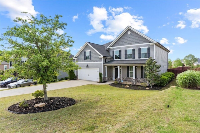 craftsman-style house featuring a front lawn, a porch, and a garage