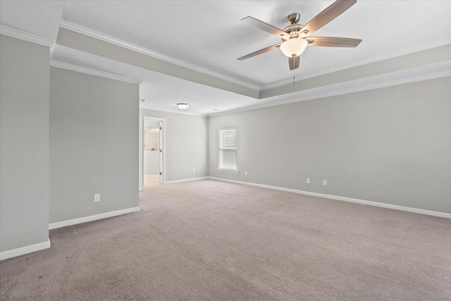 carpeted empty room featuring ceiling fan and crown molding