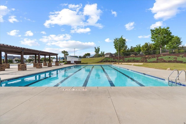 view of swimming pool with a patio area