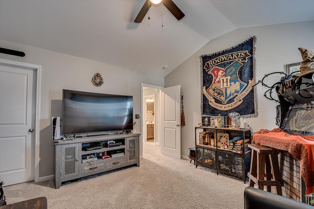 carpeted living area featuring lofted ceiling and a ceiling fan