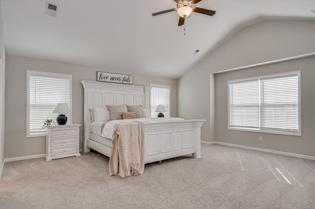 bedroom with multiple windows, light colored carpet, and visible vents