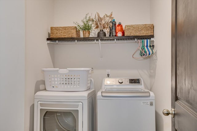 laundry area featuring laundry area and washing machine and dryer