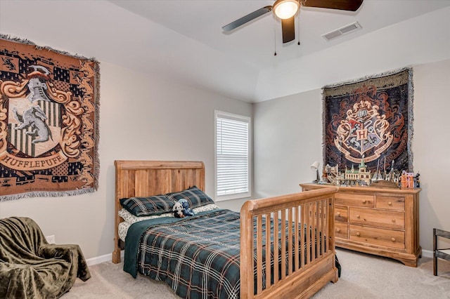 carpeted bedroom with visible vents, a ceiling fan, lofted ceiling, and baseboards