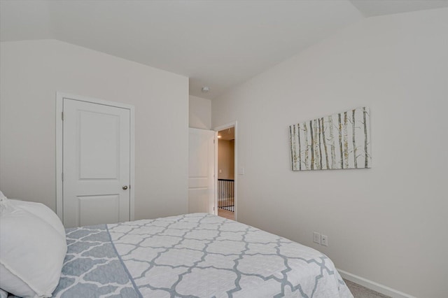 bedroom featuring vaulted ceiling