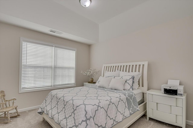 carpeted bedroom with baseboards and visible vents