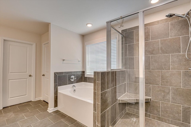 bathroom with recessed lighting, a stall shower, tile patterned flooring, and a bath