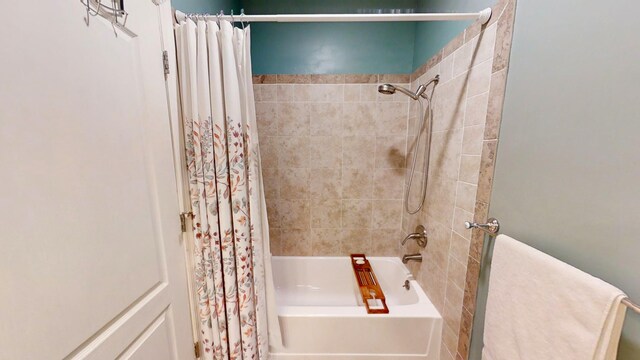 bathroom with shower / bathtub combination with curtain