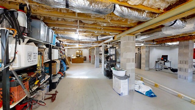 basement featuring heating unit