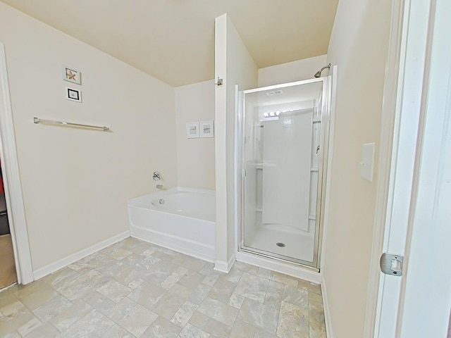 4706 Southwind Rd, Evans, GA 30809 - bathroom with a stall shower, a garden tub, baseboards, and stone finish floors