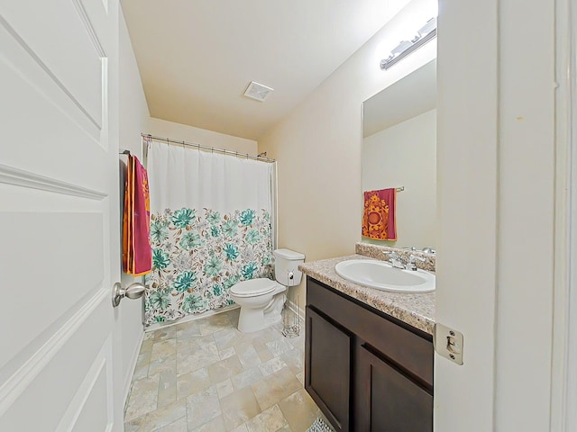 4706 Southwind Rd, Evans, GA 30809 - bathroom with toilet, vanity, a shower with shower curtain, and stone finish flooring