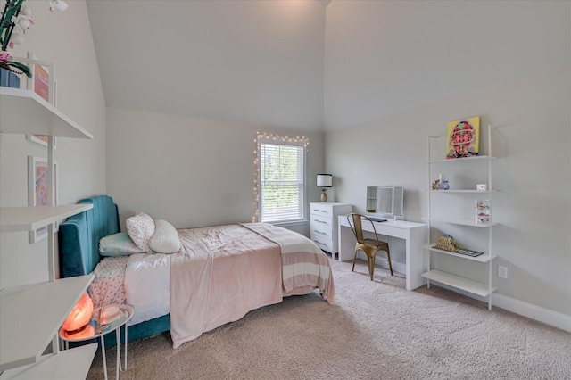 carpeted bedroom featuring lofted ceiling