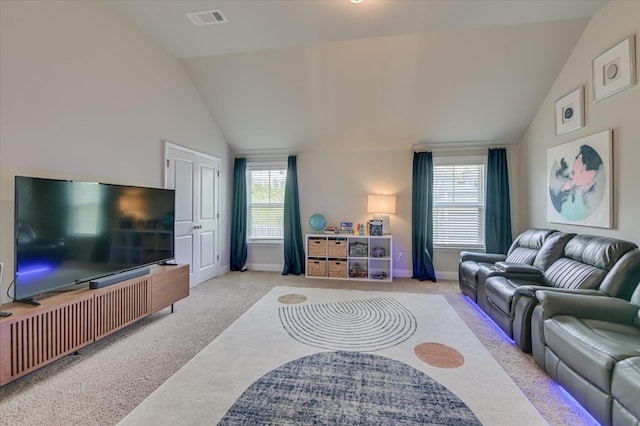 carpeted living area with vaulted ceiling, healthy amount of natural light, and baseboards