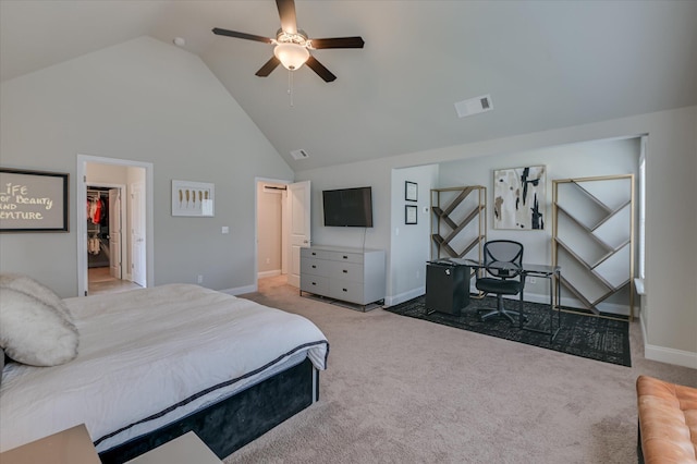 bedroom with carpet floors, a spacious closet, high vaulted ceiling, and baseboards