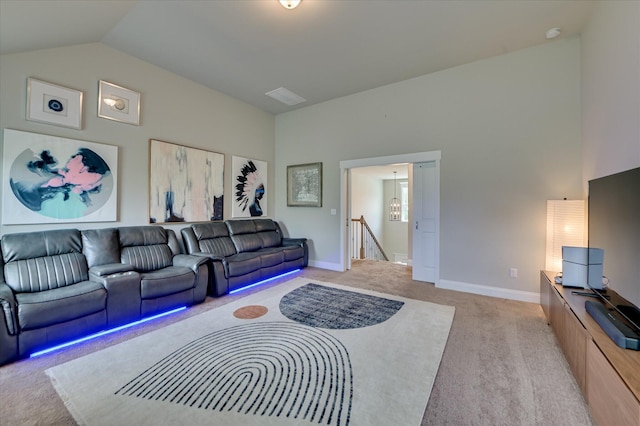 living area featuring light carpet, vaulted ceiling, and baseboards