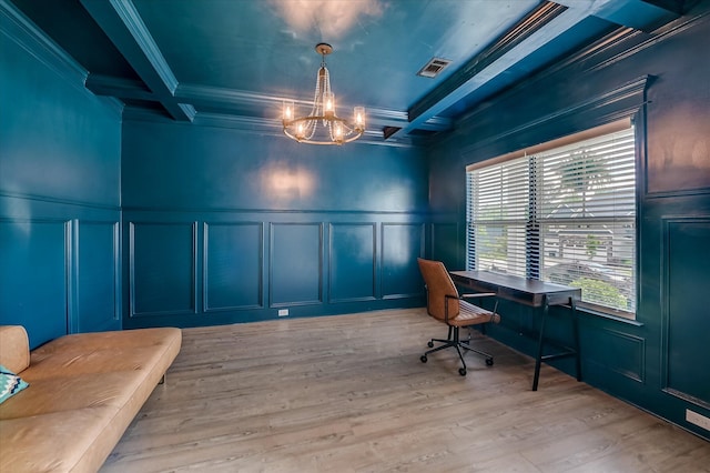 home office with a decorative wall, a chandelier, beam ceiling, coffered ceiling, and light wood finished floors
