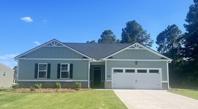 craftsman inspired home with a front yard and a garage