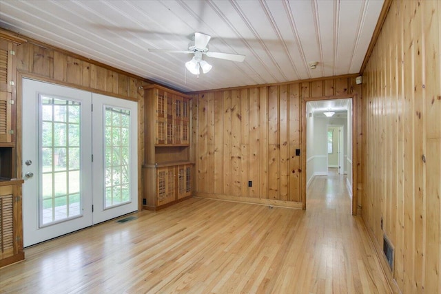 427 Ashland Dr, Augusta, GA 30909 - unfurnished room with wooden walls, light wood-style flooring, and a ceiling fan