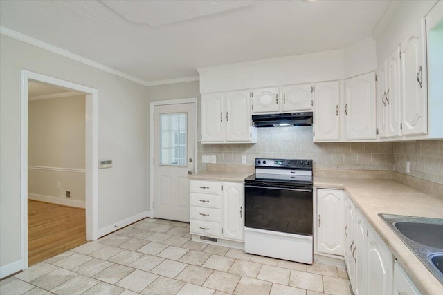 427 Ashland Dr, Augusta, GA 30909 - kitchen with range with electric stovetop, under cabinet range hood, light countertops, white cabinetry, and ornamental molding