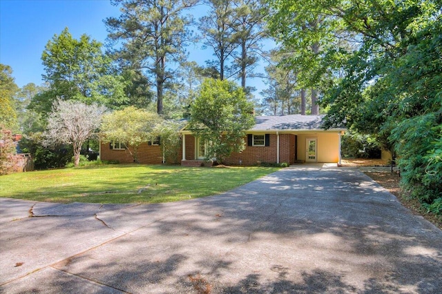 427 Ashland Dr, Augusta, GA 30909 - view of front of house with concrete driveway, a front lawn, brick siding, and a carport