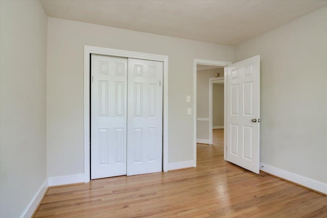 427 Ashland Dr, Augusta, GA 30909 - unfurnished bedroom featuring light wood finished floors and a closet
