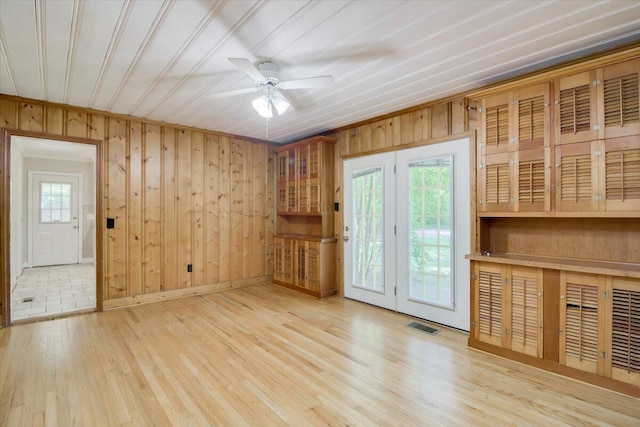 427 Ashland Dr, Augusta, GA 30909 - spare room featuring a ceiling fan, wood finished floors, and wood walls
