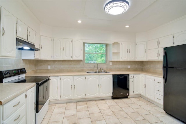 427 Ashland Dr, Augusta, GA 30909 - kitchen with black appliances, under cabinet range hood, white cabinets, decorative backsplash, and recessed lighting
