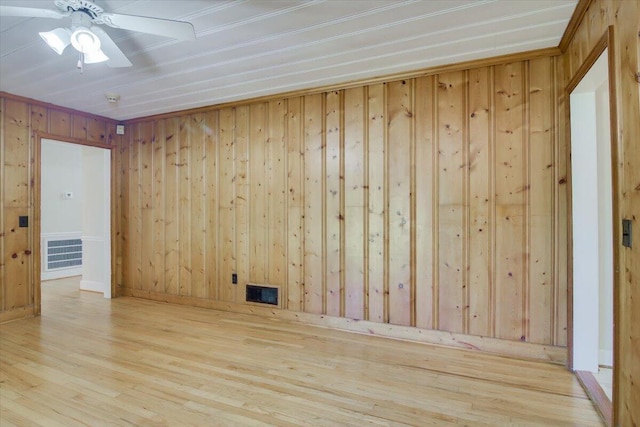 427 Ashland Dr, Augusta, GA 30909 - spare room featuring wood walls, wood finished floors, and ceiling fan