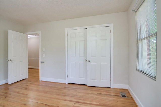 427 Ashland Dr, Augusta, GA 30909 - unfurnished bedroom with light wood finished floors and a closet