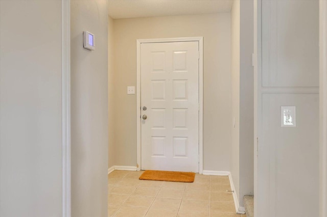 doorway to outside featuring light tile patterned floors