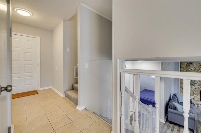 bathroom with tile patterned floors and a textured ceiling