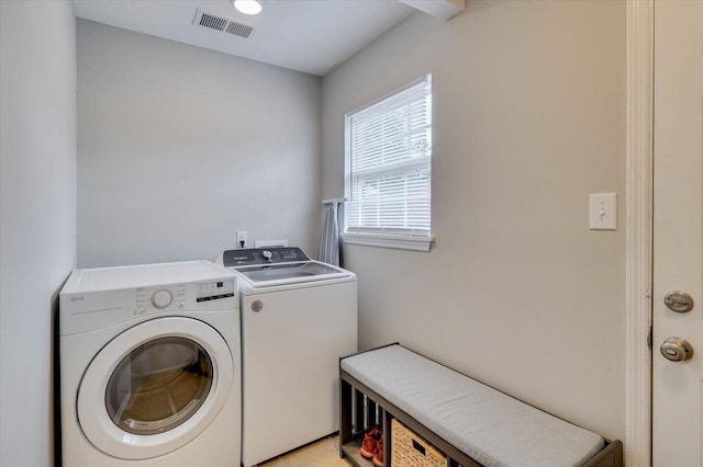 laundry room featuring washing machine and dryer