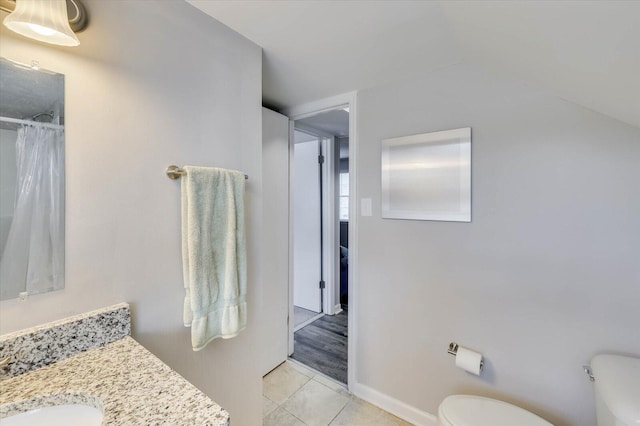 bathroom with tile patterned flooring, vanity, toilet, and a shower with curtain