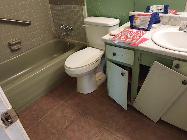 bathroom featuring tile patterned floors, shower / washtub combination, toilet, and vanity