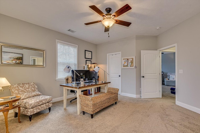 carpeted office with ceiling fan