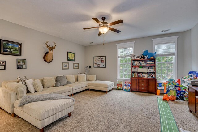 living room with carpet flooring and ceiling fan