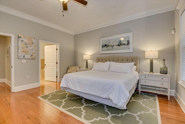 bedroom featuring connected bathroom, ceiling fan, crown molding, and light hardwood / wood-style floors