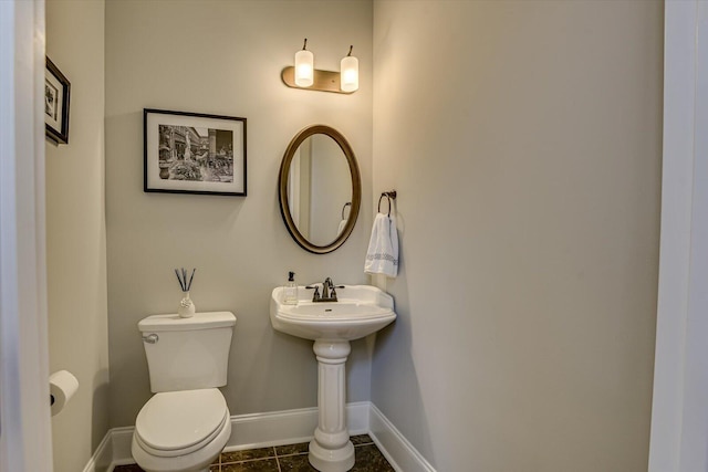 bathroom with tile patterned floors and toilet