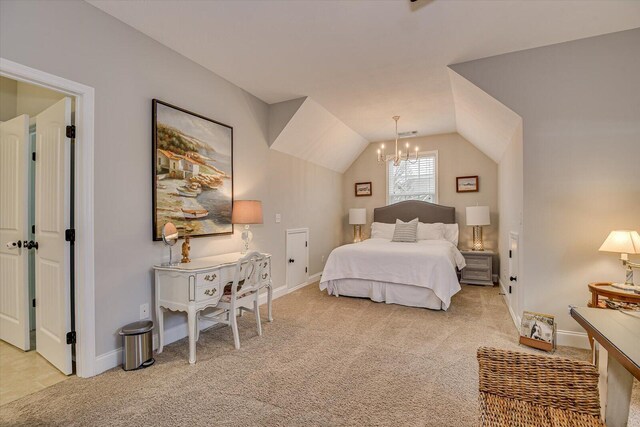 carpeted bedroom with vaulted ceiling and a notable chandelier