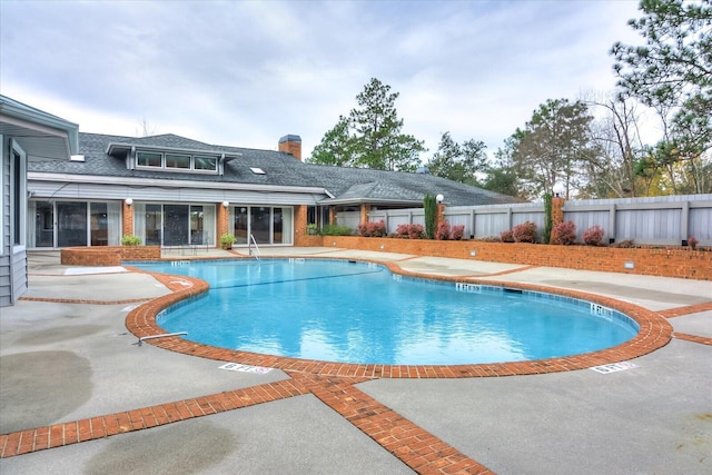 view of swimming pool featuring a patio area