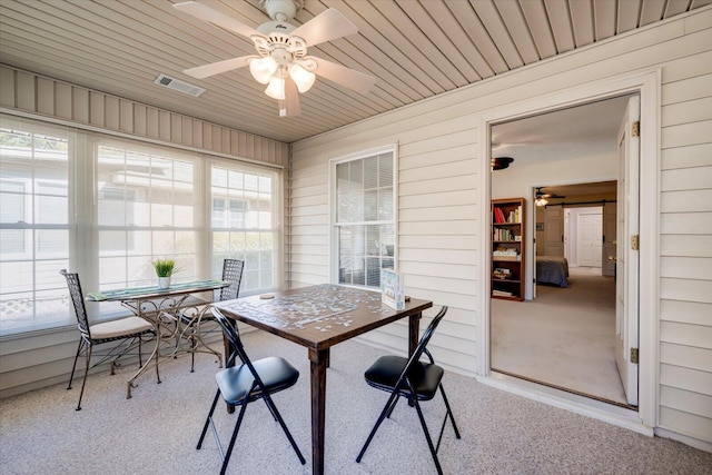 sunroom with ceiling fan and wood ceiling